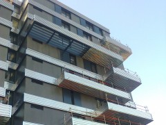 Réalisation de façade en bardage INOX sur ...